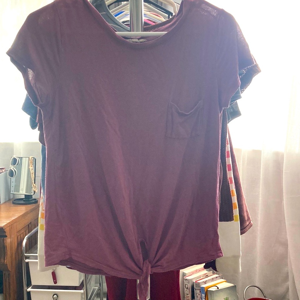 Size medium glitz shirt. Light purple/pink color.